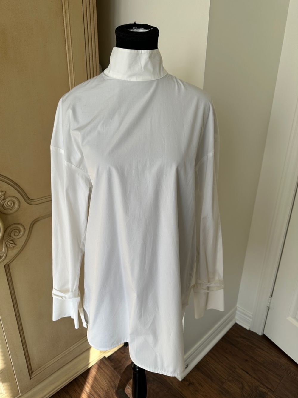 Lou Lou Studio White High-Neck Long Sleeve tunic.